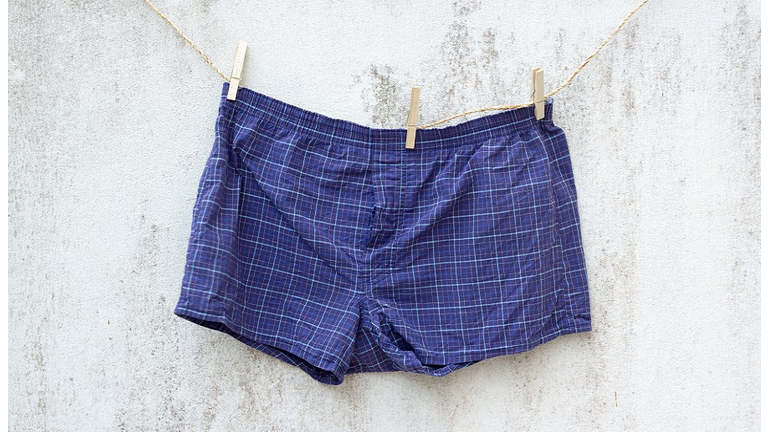 blue boxer underwear on grunge wall