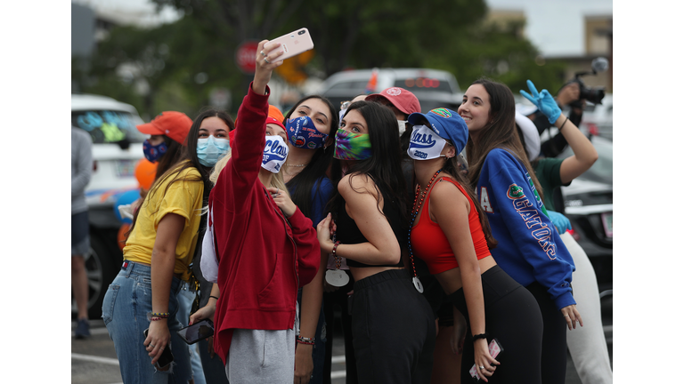 Parade Of Graduating High School Seniors Cheered By Community In Florida