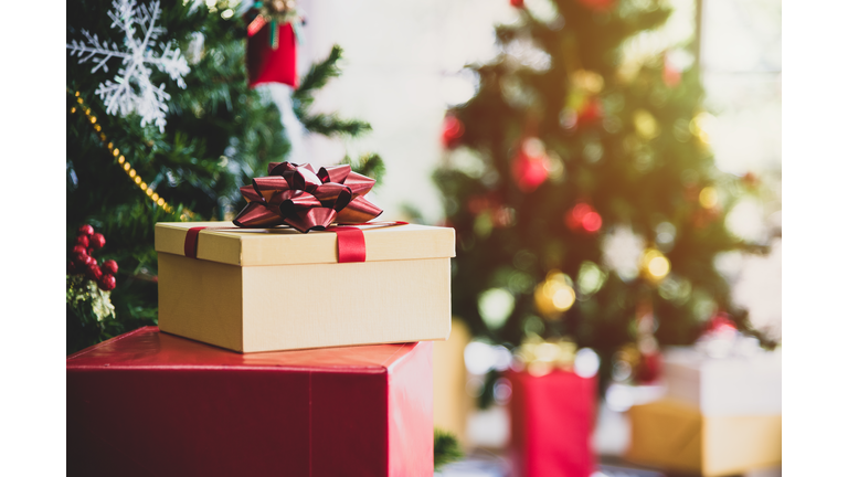 Christmas tree with gifts and decorations in living room