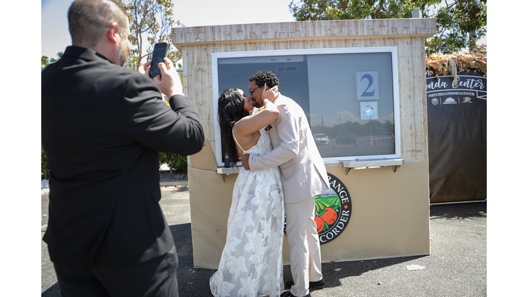 Couples Exchange Vows At Pop-Up Socially Distanced Marriage Booths At Honda Center