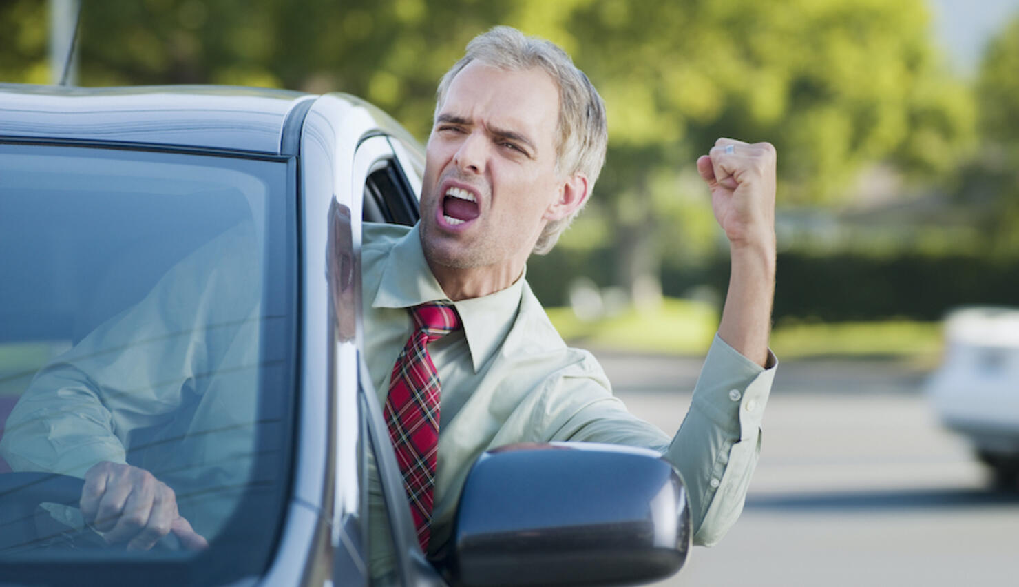 Angry driver shouting out car window