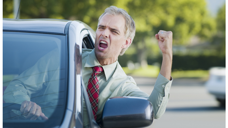 Angry driver shouting out car window
