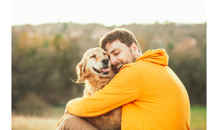 Guy and his dog, golden retriever, nature
