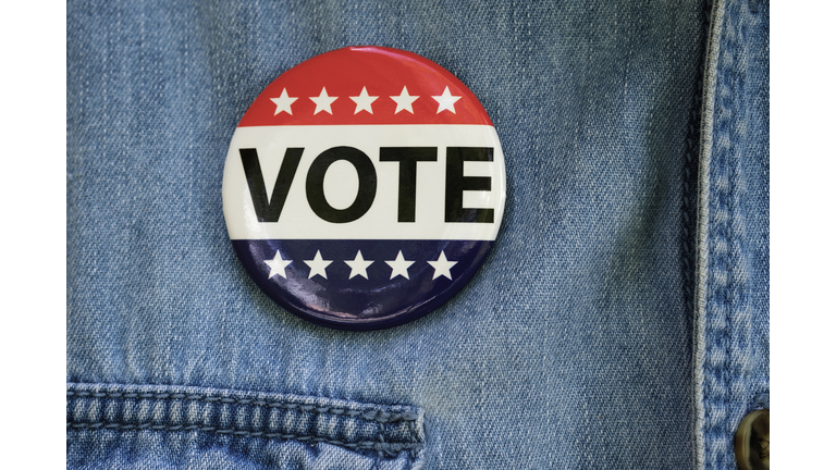 Vote button on denim jacket