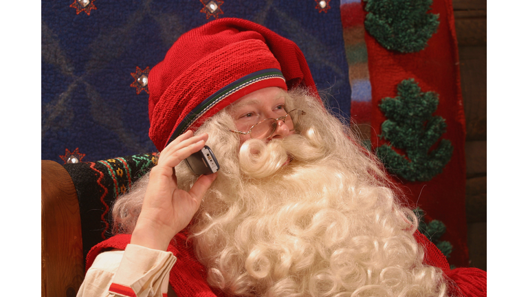 Santa Claus Takes A Call On His Mobile Phone