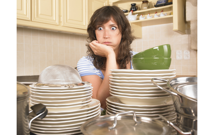 woman with piles of washing up