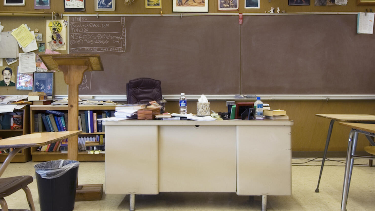 Classroom with teacher's desk in middle of room