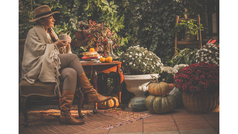 Woman enjoying sunny day in back yard