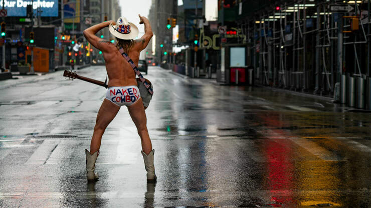 The Naked Cowboy performing in Time Square, New York, USA 