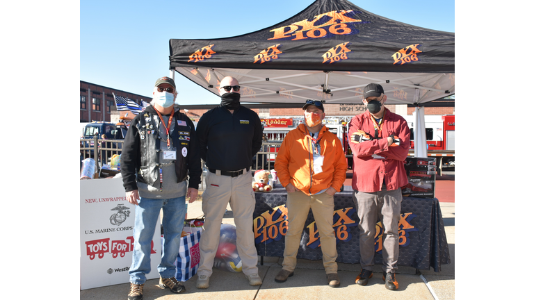 PYX106's Quinn, Cantara & Dr. John pose with Steven Gordon of the Saratoga County Sheriff's Department at the Convoy for Tots.