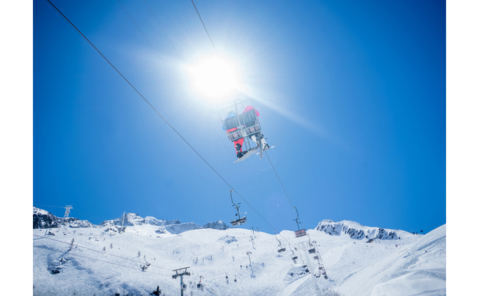 Couple in a ski lift chair