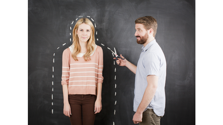 Young couple, man with chalk outline