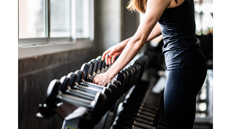 Young Woman Exercising In Gym