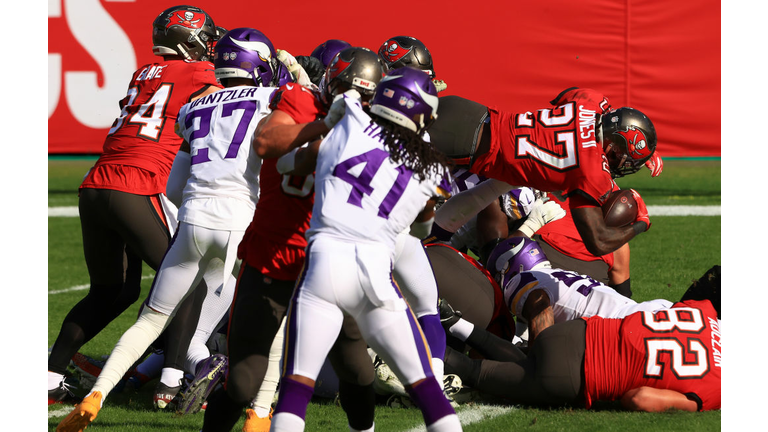 Ronald Jones plunges in to the end zone from a yard in the second quarter of Sunday's win over the Minnesota Vikings.