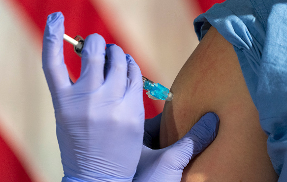 A volunteer getting a Covid Vaccine Candidate during test period