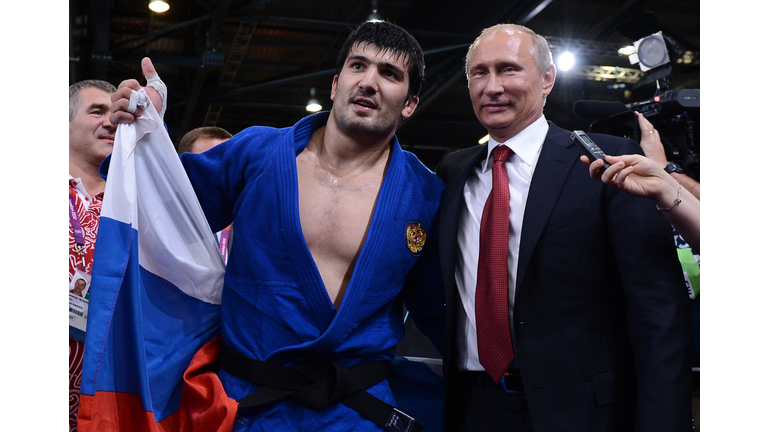 Russia's Tagir Khaibulaev (L) poses with