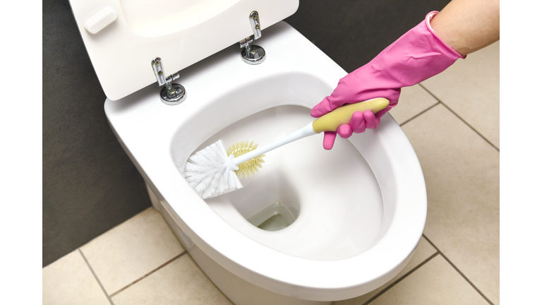 CLEANING TOILET WITH TOILET BRUSH
