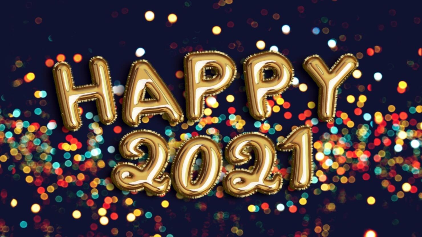 happy new year 2021 foiled golden balloon in black background with confetti