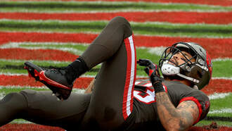 Evans Injures Knee in 44-27 Buccaneer Win Over Atlanta