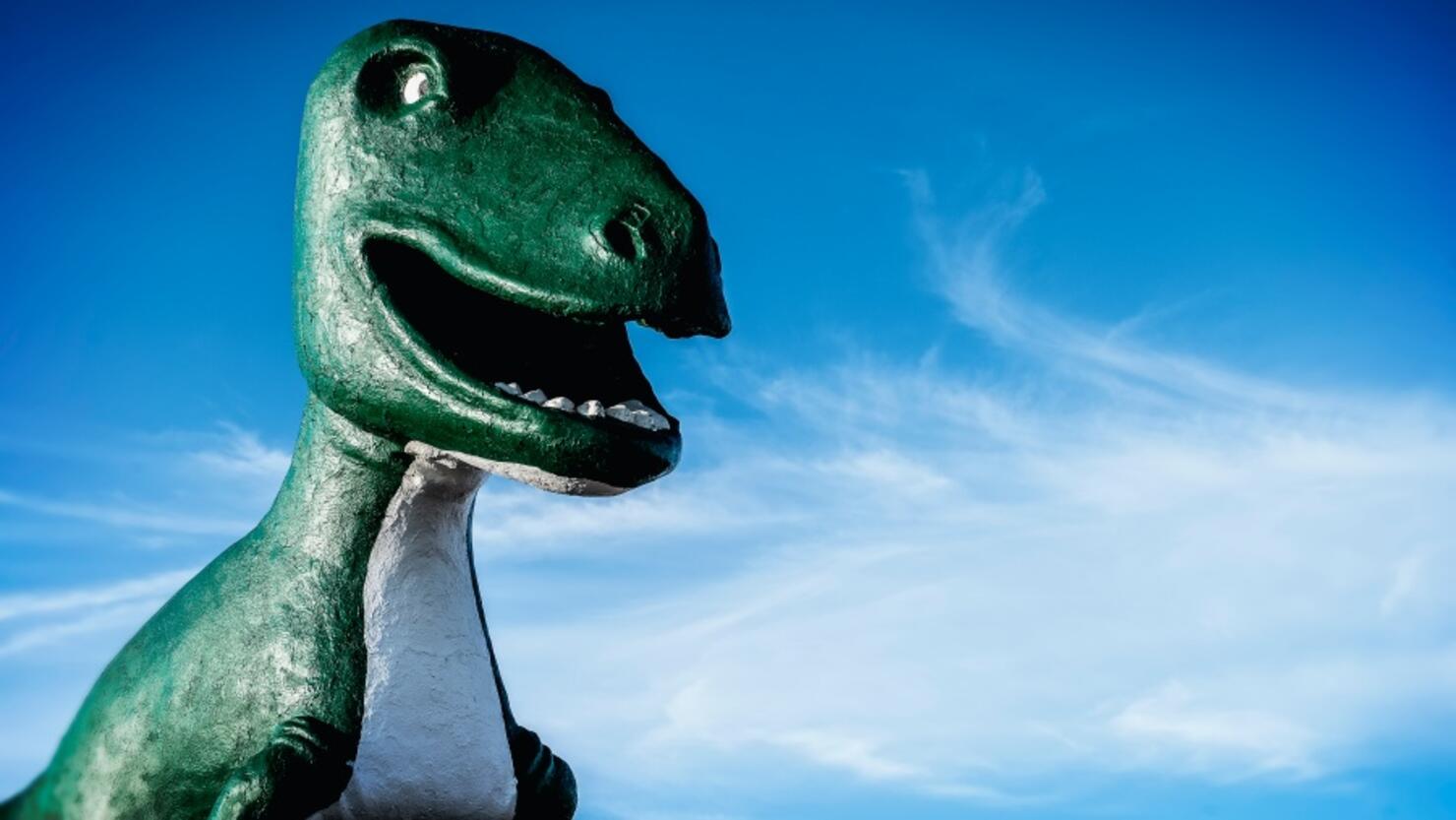 Tyrannosaurus Rex statue under blue sky
