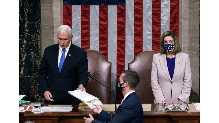 Nancy Pelosi and Mike Pence (Getty)