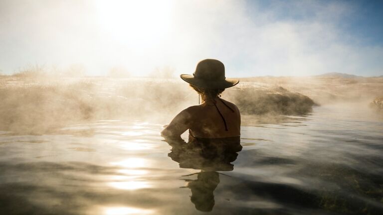 A woman relaxing in a hot spring.