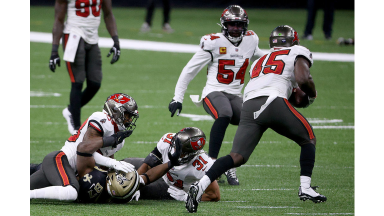 Devin White recovers a fumble in the 3rd quarter of Sunday's 30-20 upset of the New Orleans Saints