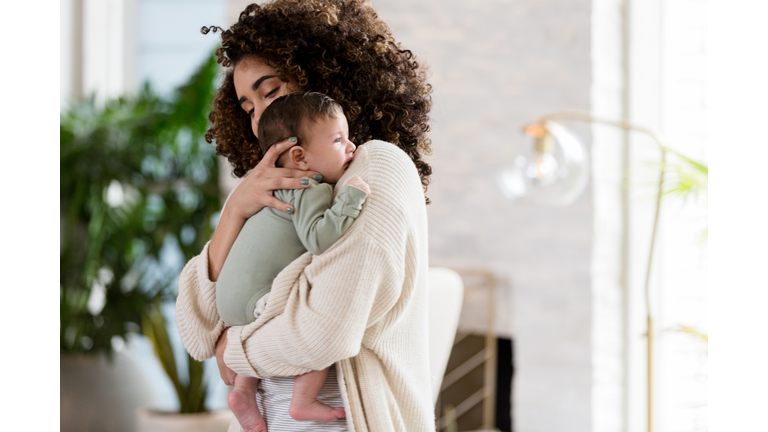 Mom comforts fussy baby