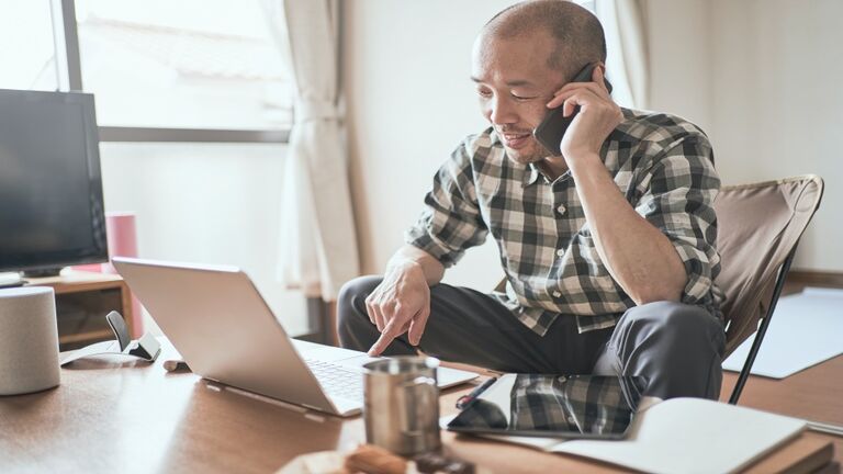 Asian male worker working from Home.