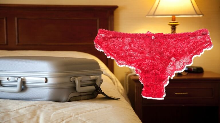 suitcase on bed in hotel room