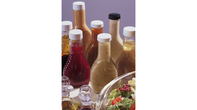 Salad with assorted bottles of dressing