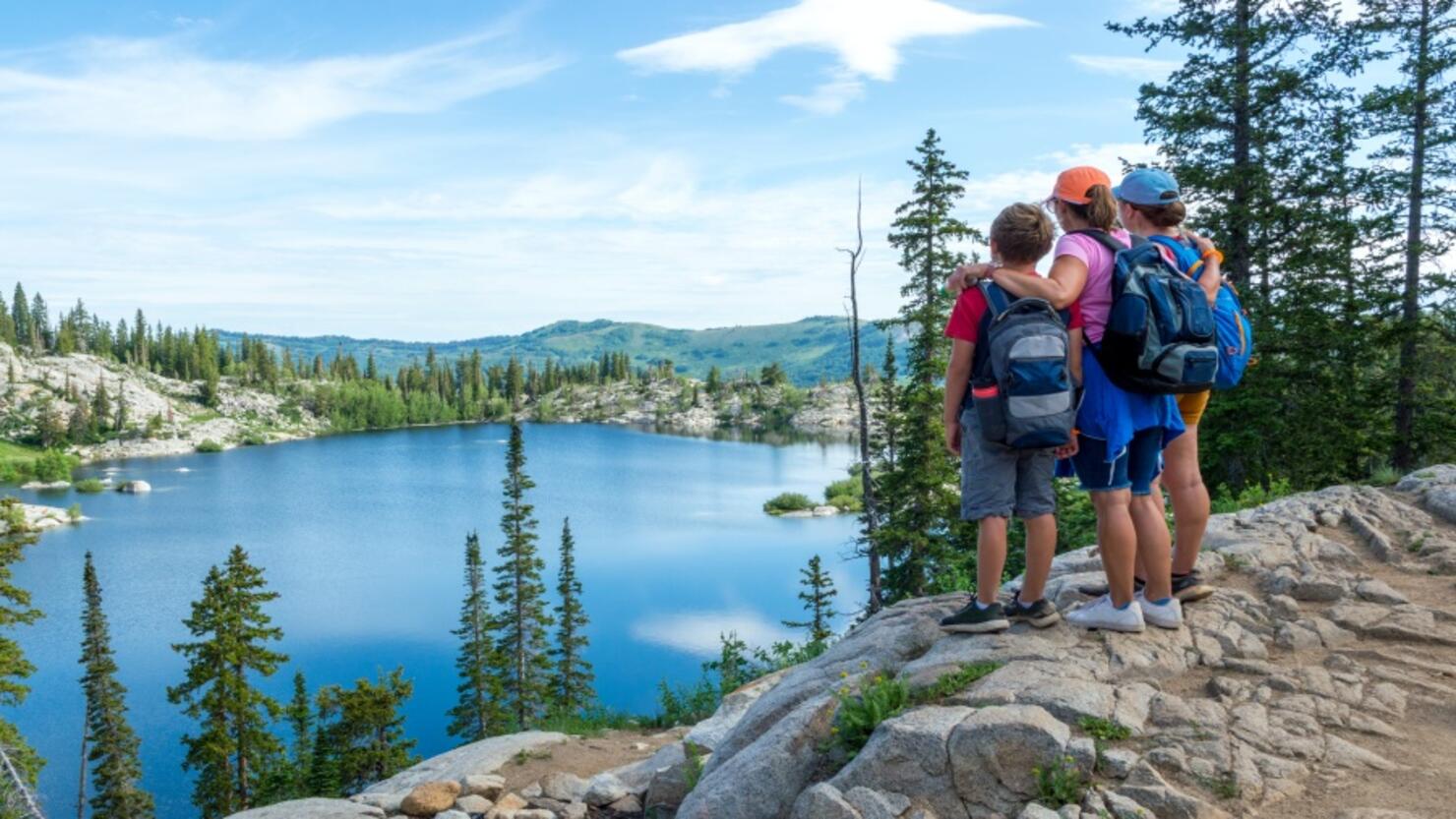 Family Admiring a Panoramic Scene Above a Mountain Lake - Lake Mary in the Wasatch Mountains of Utah