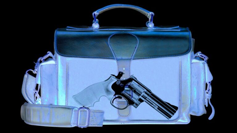 Xray scan detects weapon in criminals briefcase