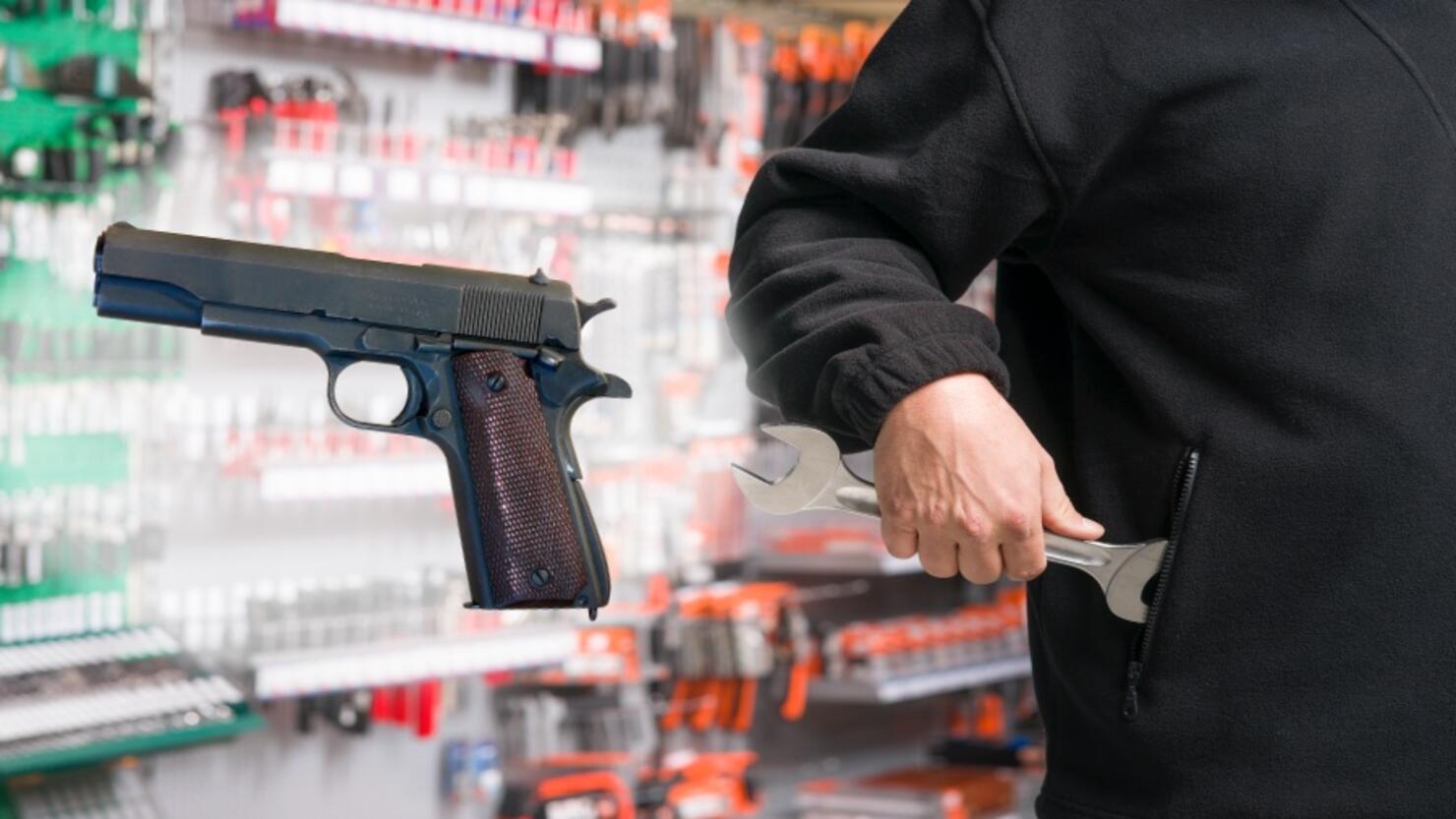 Man stealing a wrench from a hardware store
