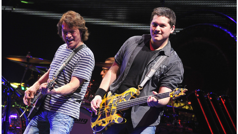 Eddie Van Halen with Wolfgang on stage playing their guitars