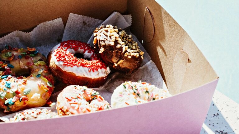 High Angle View Of Donuts In Box.