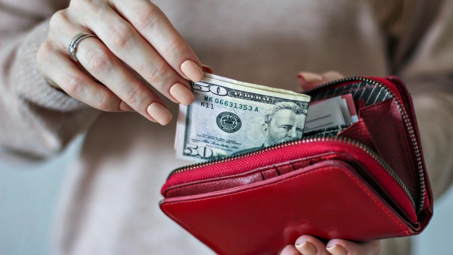 Midsection Of Woman Holding Purse