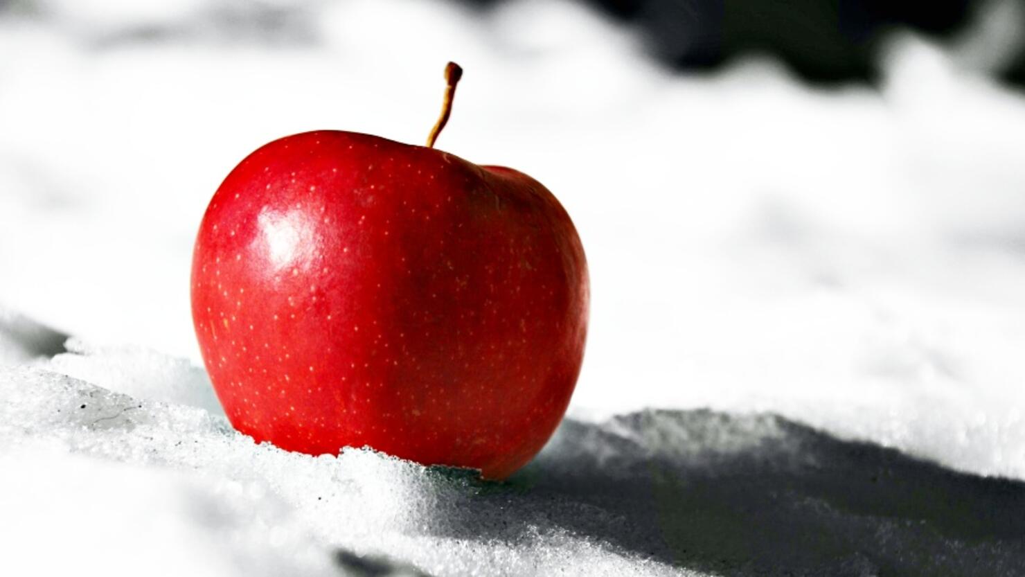 Close-Up Of Apple On Snow
