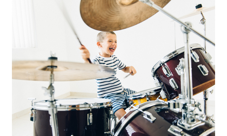 Little boy playing drums