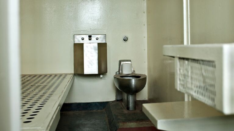 Open door to prison cell