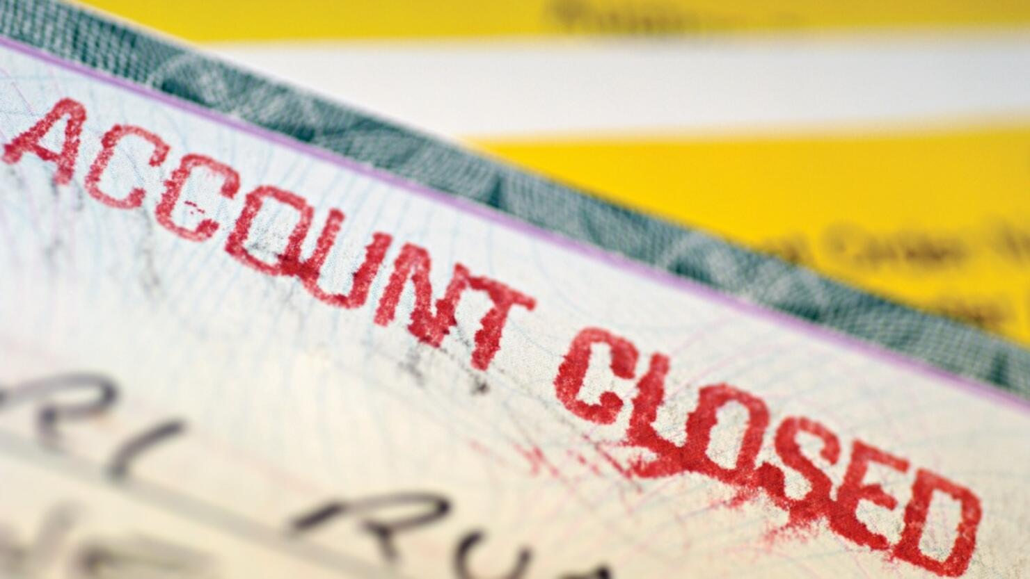 "Check with account closed written on it, close-up"