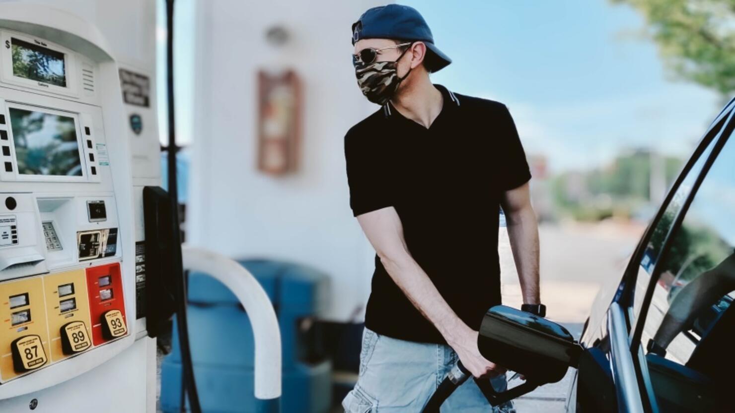 Man Pumps Gas Wearing Protective Face Mask
