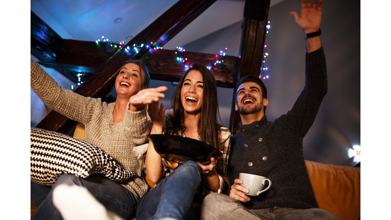 Watching late night television show.