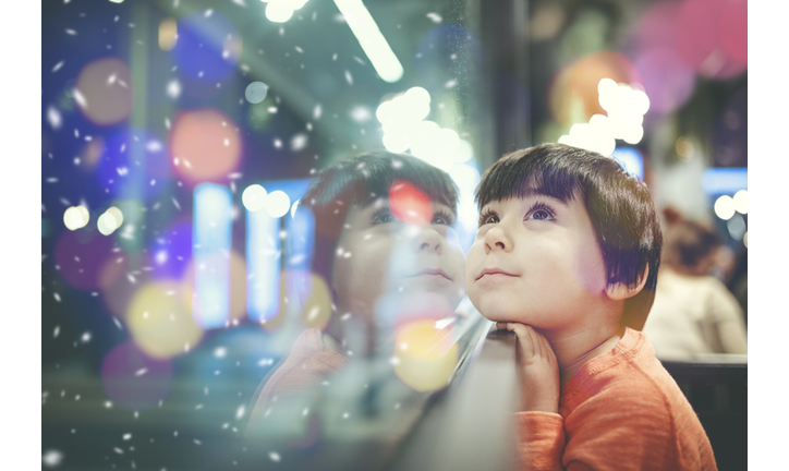 Little boy looking out of the window
