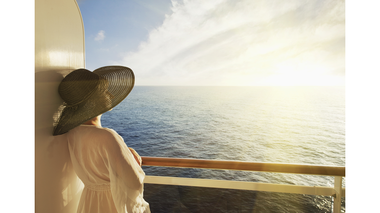 Woman looking out to sea on a cruise ship