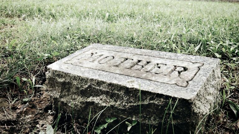 View Of Cemetery Headstone That Says Mother