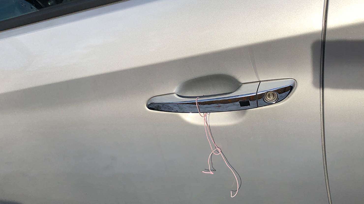 If You See A String Tied To Your Car Door Handle, Do Not Call The Police |  iHeart
