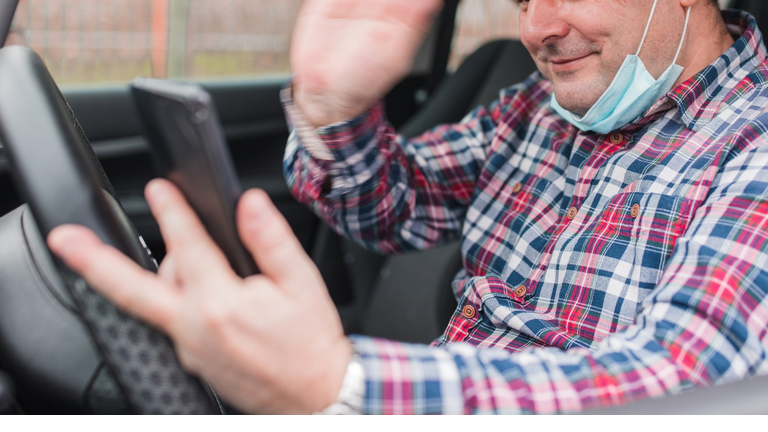 Man having video call when driving a car