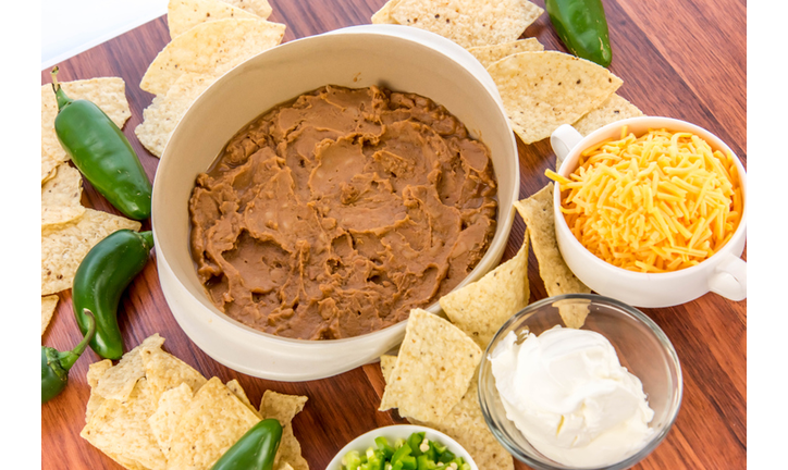 bean dip with jalapenos, sour cream and cheddar cheese