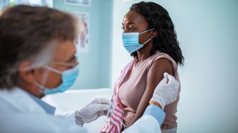Young woman getting vaccinated